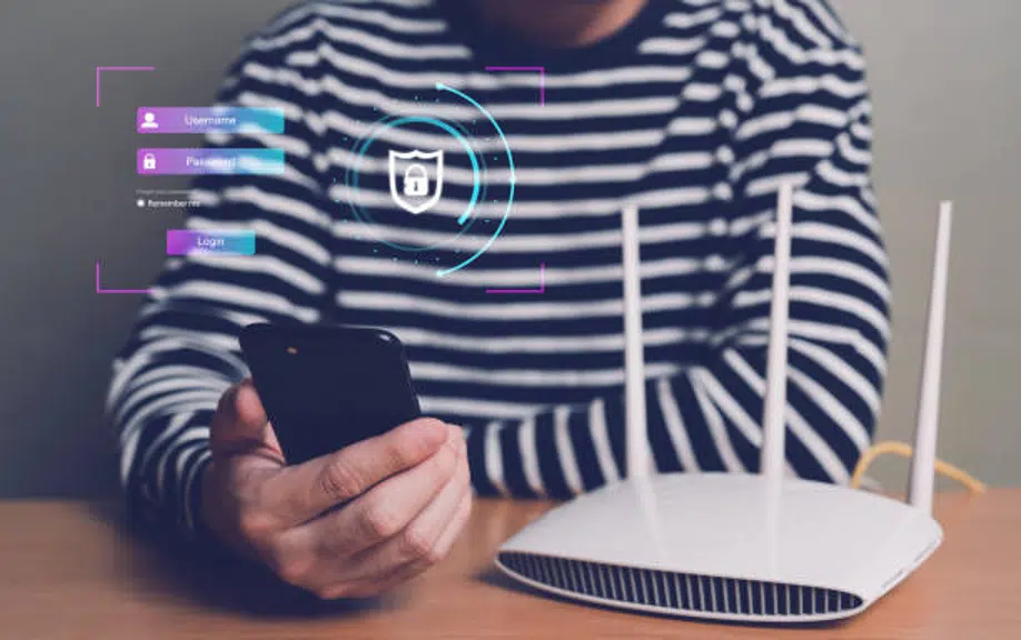 Person securing WiFi router with smartphone login