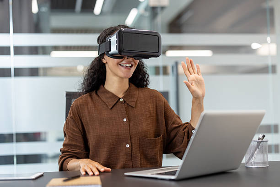 Person using VR headset at work desk