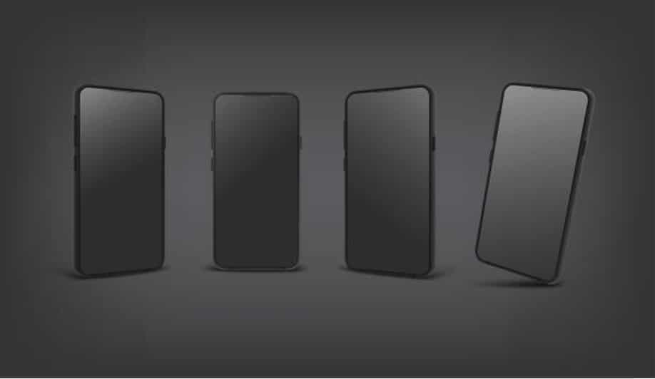 Four modern smartphones on dark background