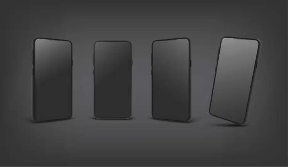 Four modern smartphones on dark background